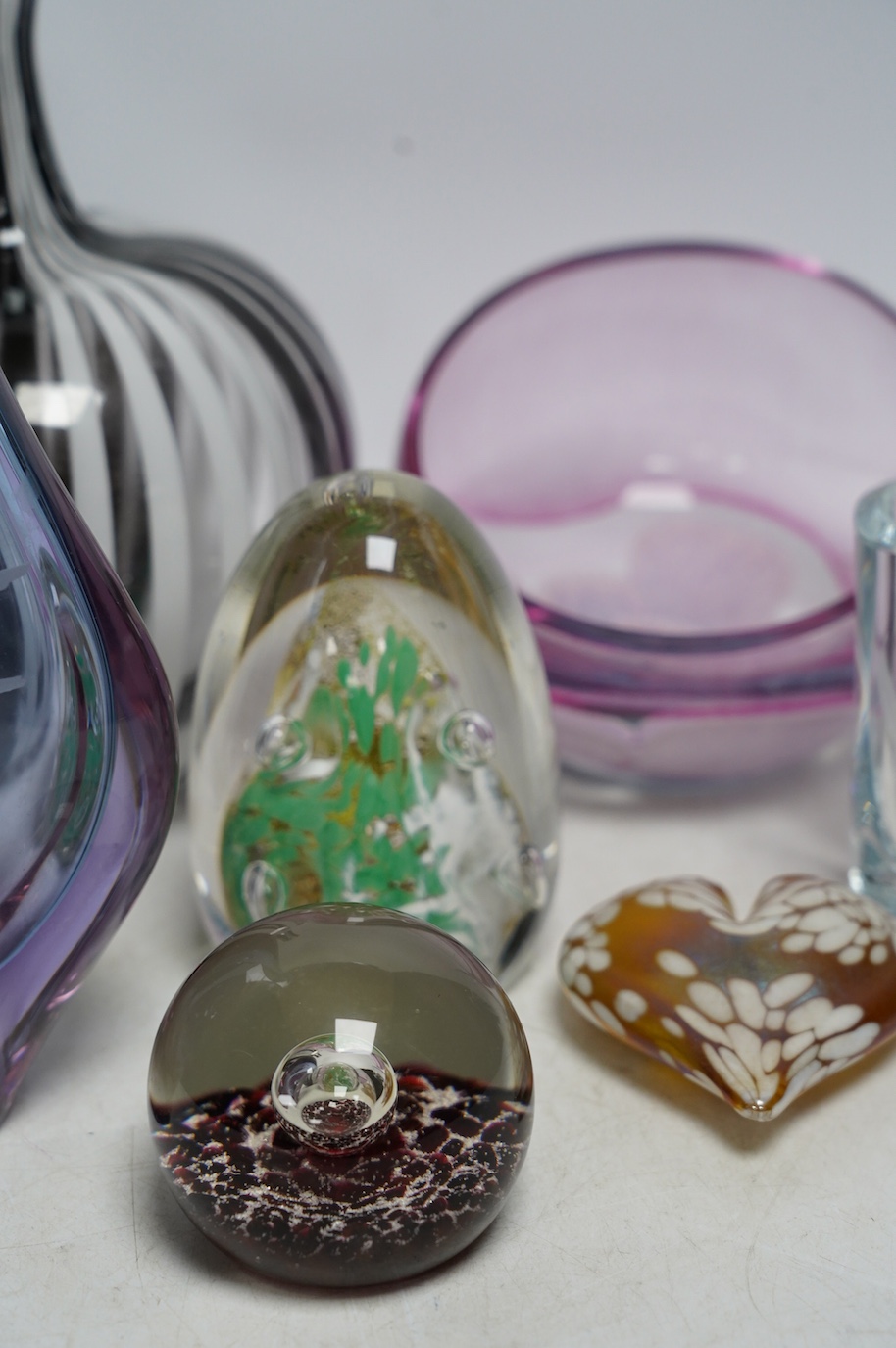 A group of ornamental coloured glass vases and paperweights including Murano, largest 22cm high (8). Condition - good